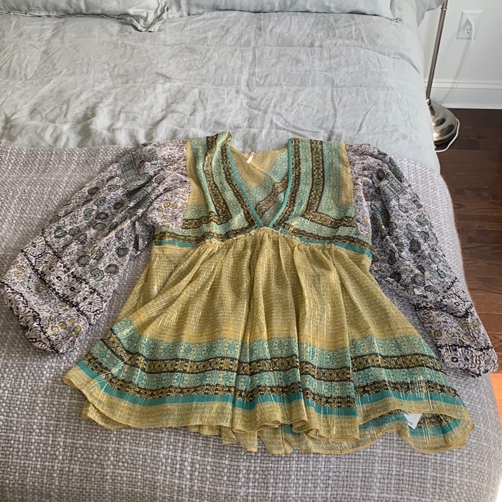 Free people sheer peplum top with gold in leaves throughout the entire top!!